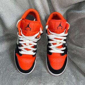 Black and Orange Jordan 1 Lows 6Y